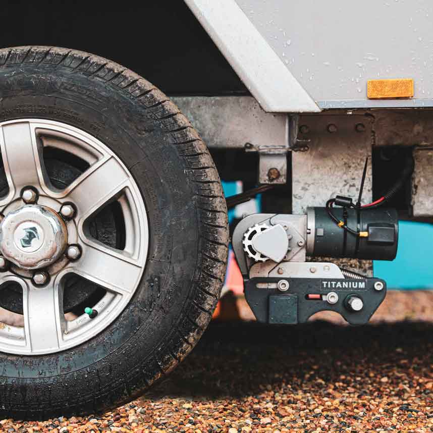 caravan tyre with purple line titanium caravan mover installed behind it